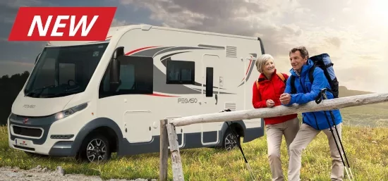 Man and woman outdoors beside a motorhome